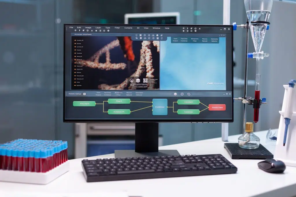 Computer standing on table with microbiology research on display during pharmaceutic biochemical experiment in biochemistry hospital laboratory. Biochemical researcher expertise